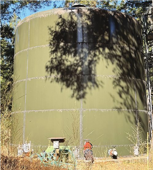 The canyon’s large green water storage tank