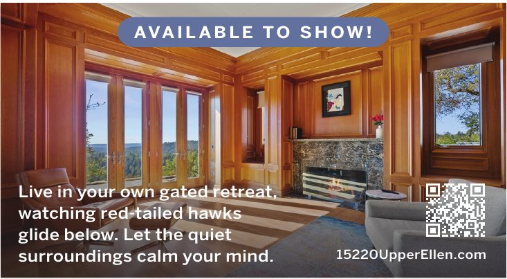 Wood-paneled living room with fireplace at 15220 Upper Ellen Road. Available to show.