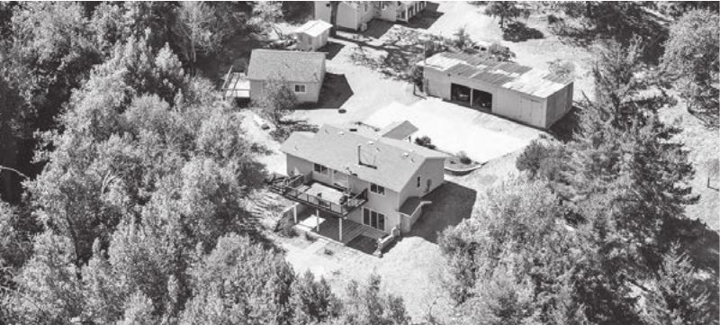 Aerial view of the home and outbuildings at 24766 Skyland Road
