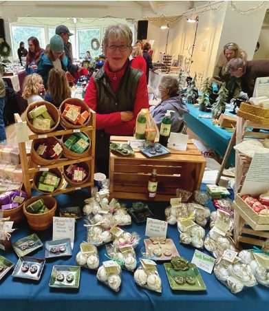 A vendor with handmade goods at the bazaar